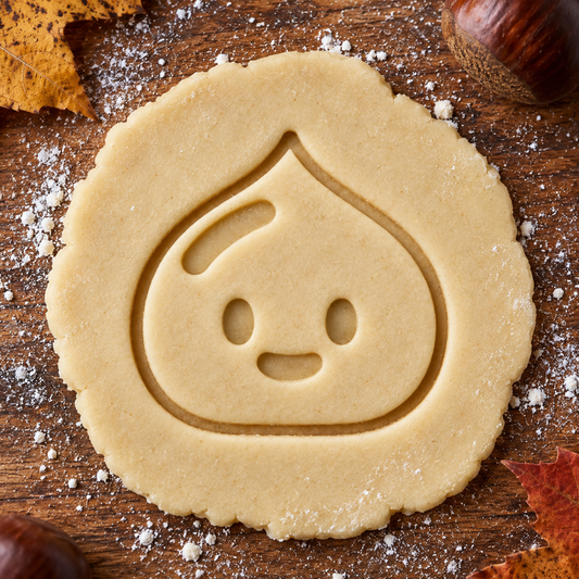 Happy Chestnut imprint pressed into cookie dough